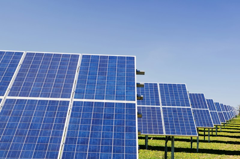 Family looking at solar panels in New Mexico